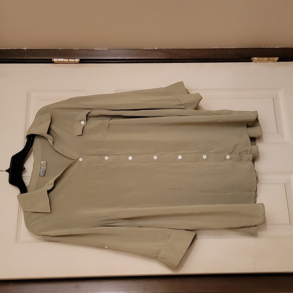 Women's 3/4 sleeve button down blouse.